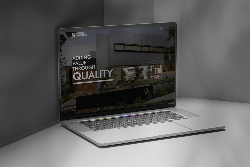 Webdesign für Geisler Property Laptop Ansicht